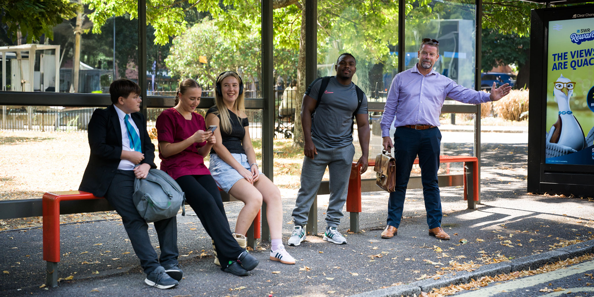 customers waiting at a bus stop